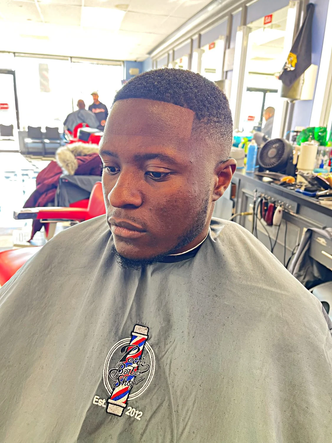 Short finished haircut with a clean fade