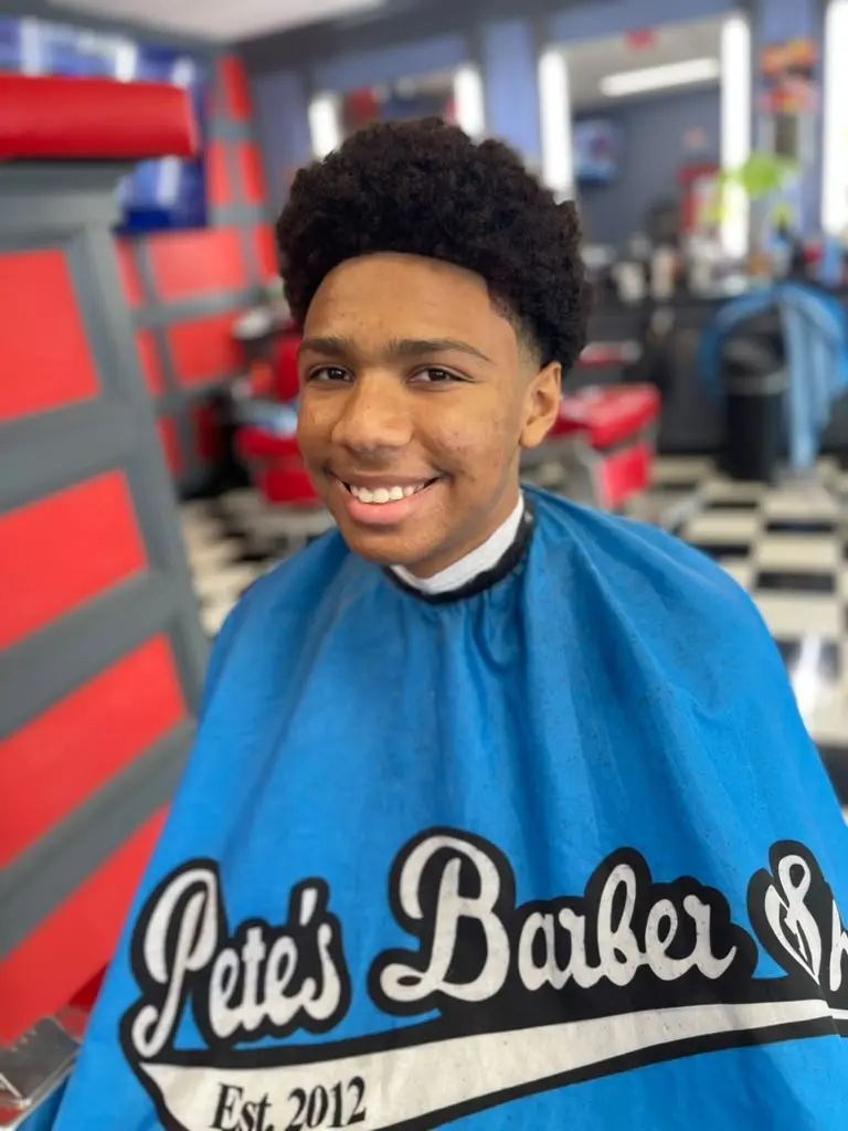 Finished haircut with a shaped natural top